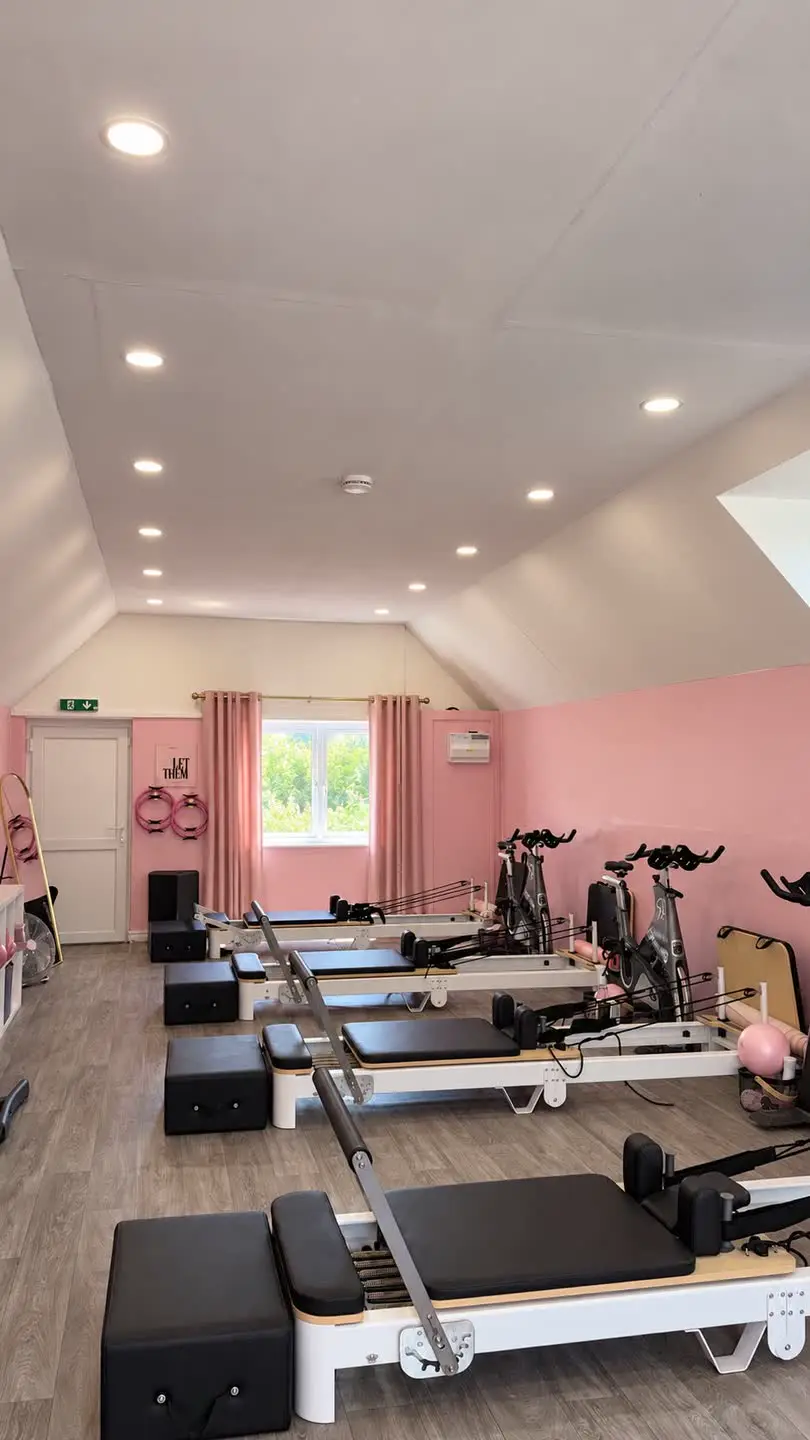 Reformer pilates studio at Fabulook Fitness in Arrington, looking down the room toward the window