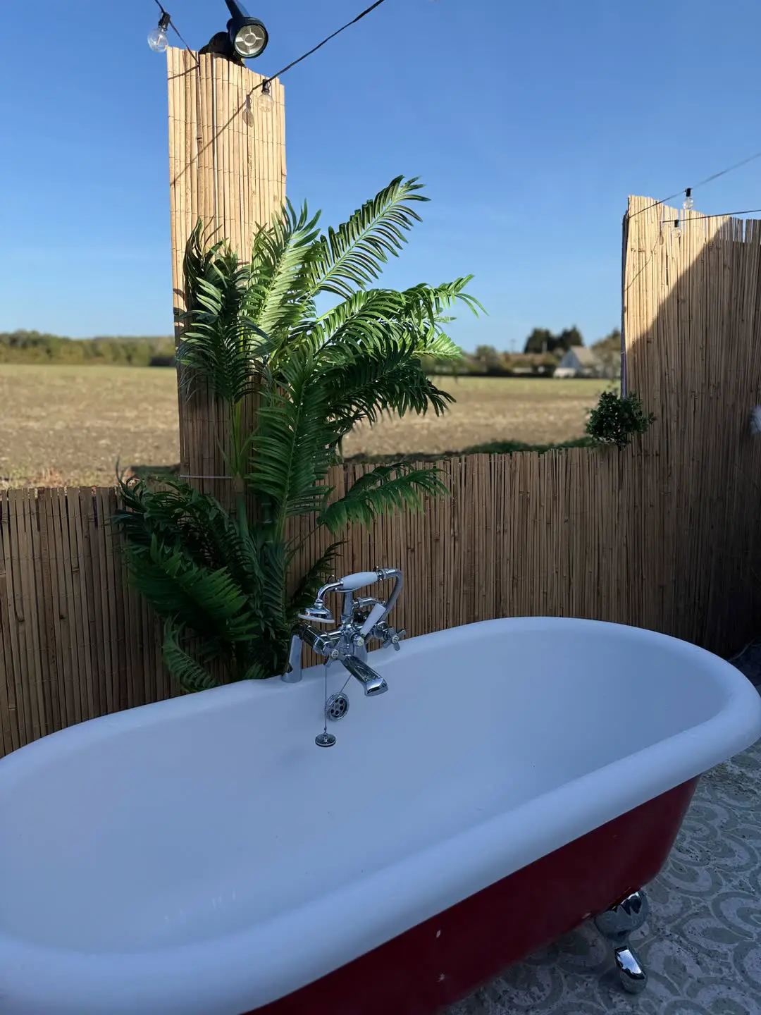 Outdoor bath at Fabulook Wellness Studio, Arrington, looking over the Cambridgeshire fields